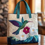 Bolso tote acolchado blanco y turquesa con colibrí esmeralda y flor fucsia